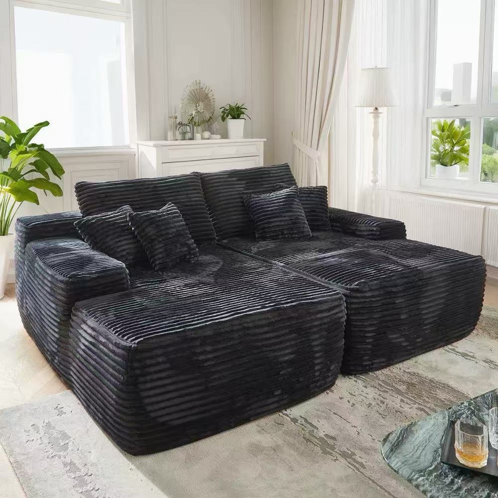 Oversized corduroy convertible sofa bed with easy pull-out design in a modern living room