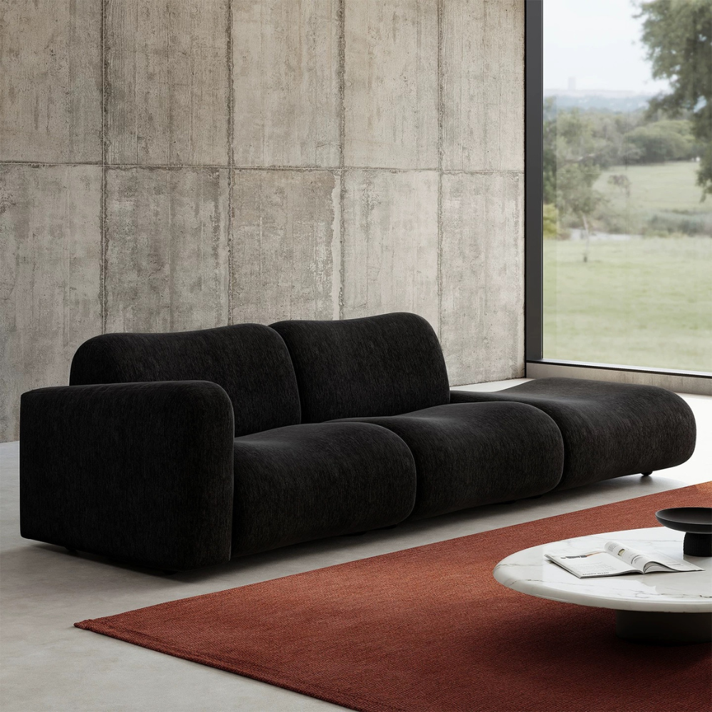 Black modular lamb wool sofa—vacuum‑packed single‑block or sectional layout in plush lamb wool. Ideal for modern living rooms, studios, and guest spaces.