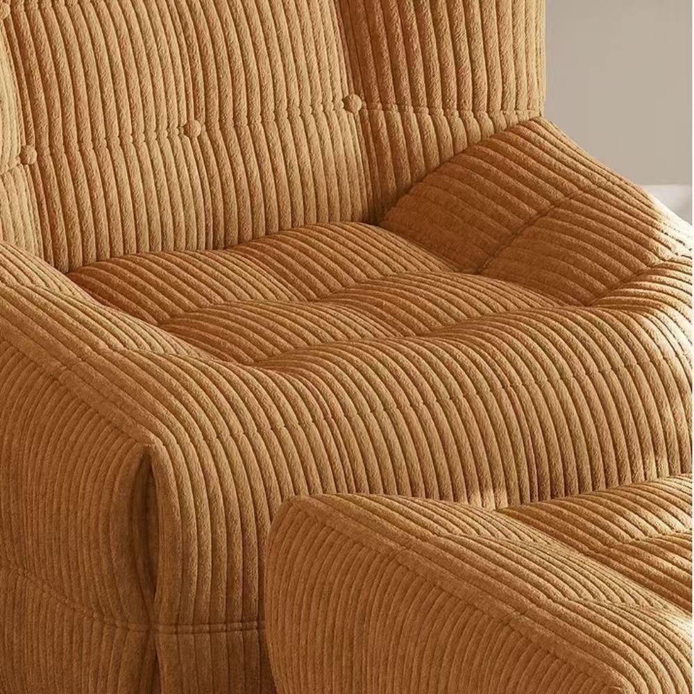 Quilted marshmallow‑style compressed sofa in plush corduroy bouclé—compact cozy seating ideal for small living rooms and guest areas.