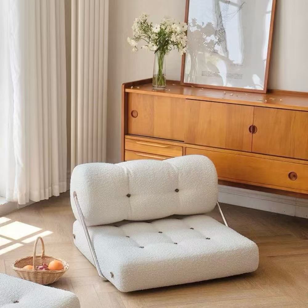 Multifunctional foldable sofa bed in elegant boucle fabric—convertible futon-style sleeper for cozy small apartments and living rooms.