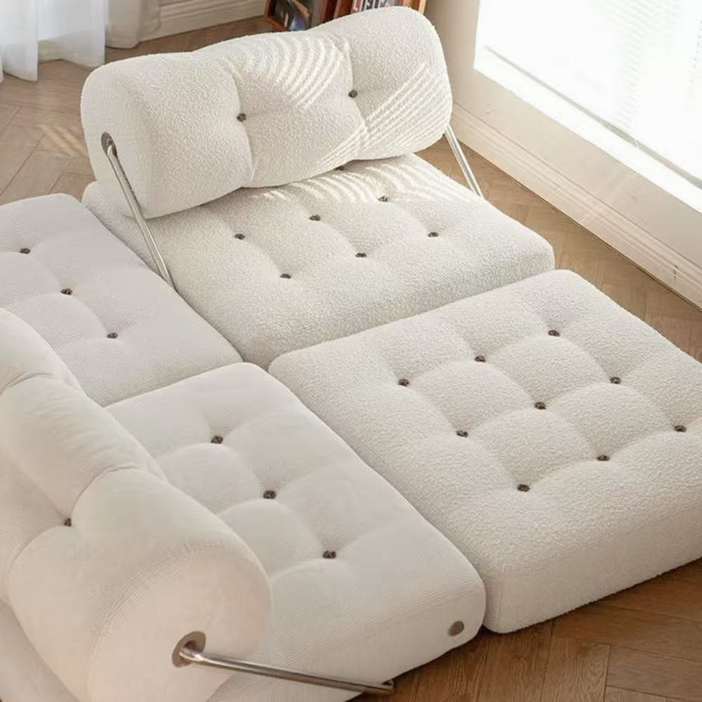 Multifunctional foldable sofa bed in elegant boucle fabric—convertible futon-style sleeper for cozy small apartments and living rooms.