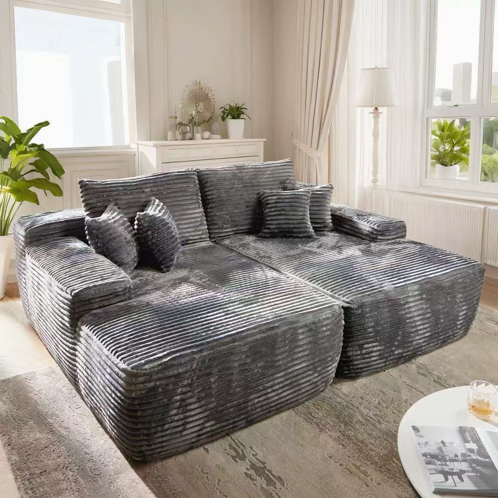 Oversized corduroy convertible sofa bed with easy pull-out design in a modern living room.