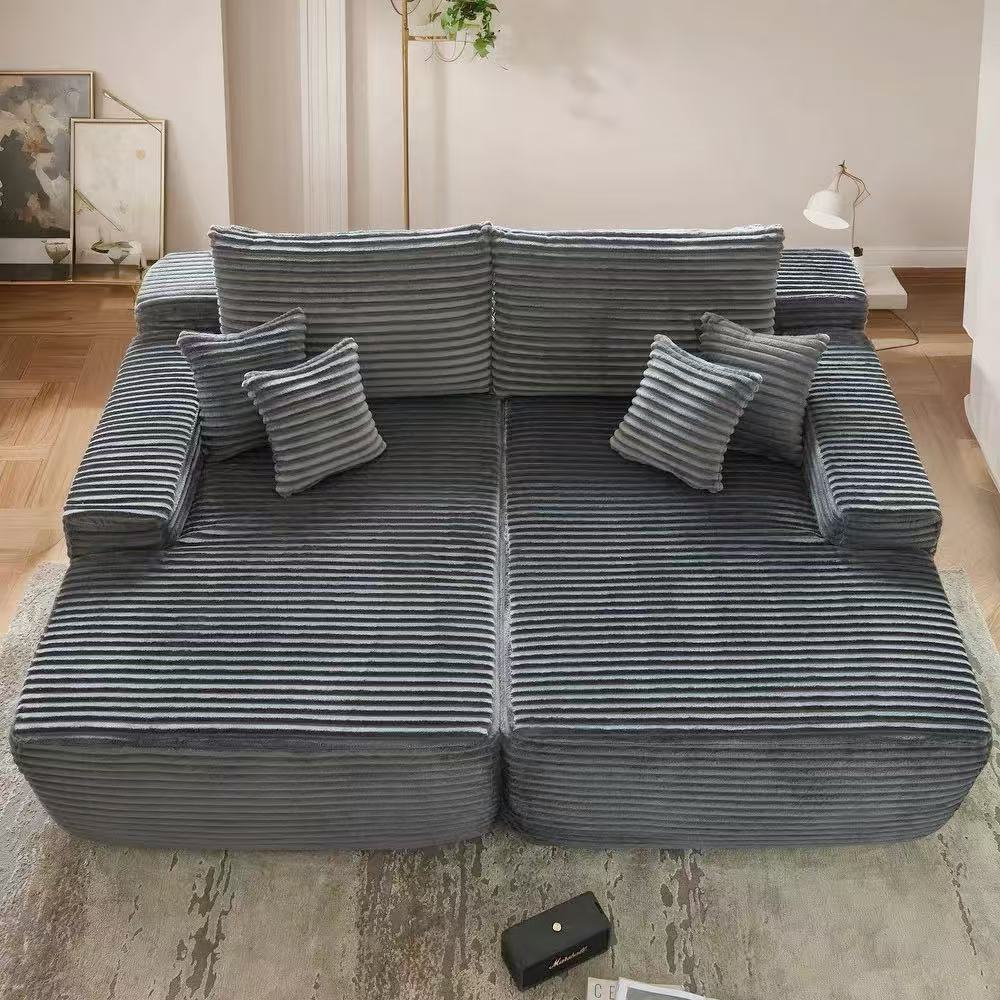 Oversized corduroy convertible sofa bed with easy pull-out design in a modern living room