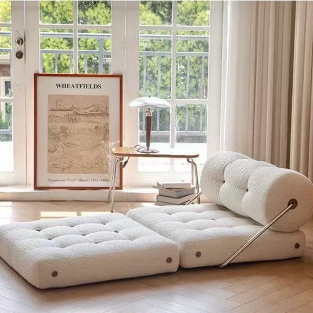 Multifunctional foldable sofa bed in elegant boucle fabric—convertible futon-style sleeper for cozy small apartments and living rooms.