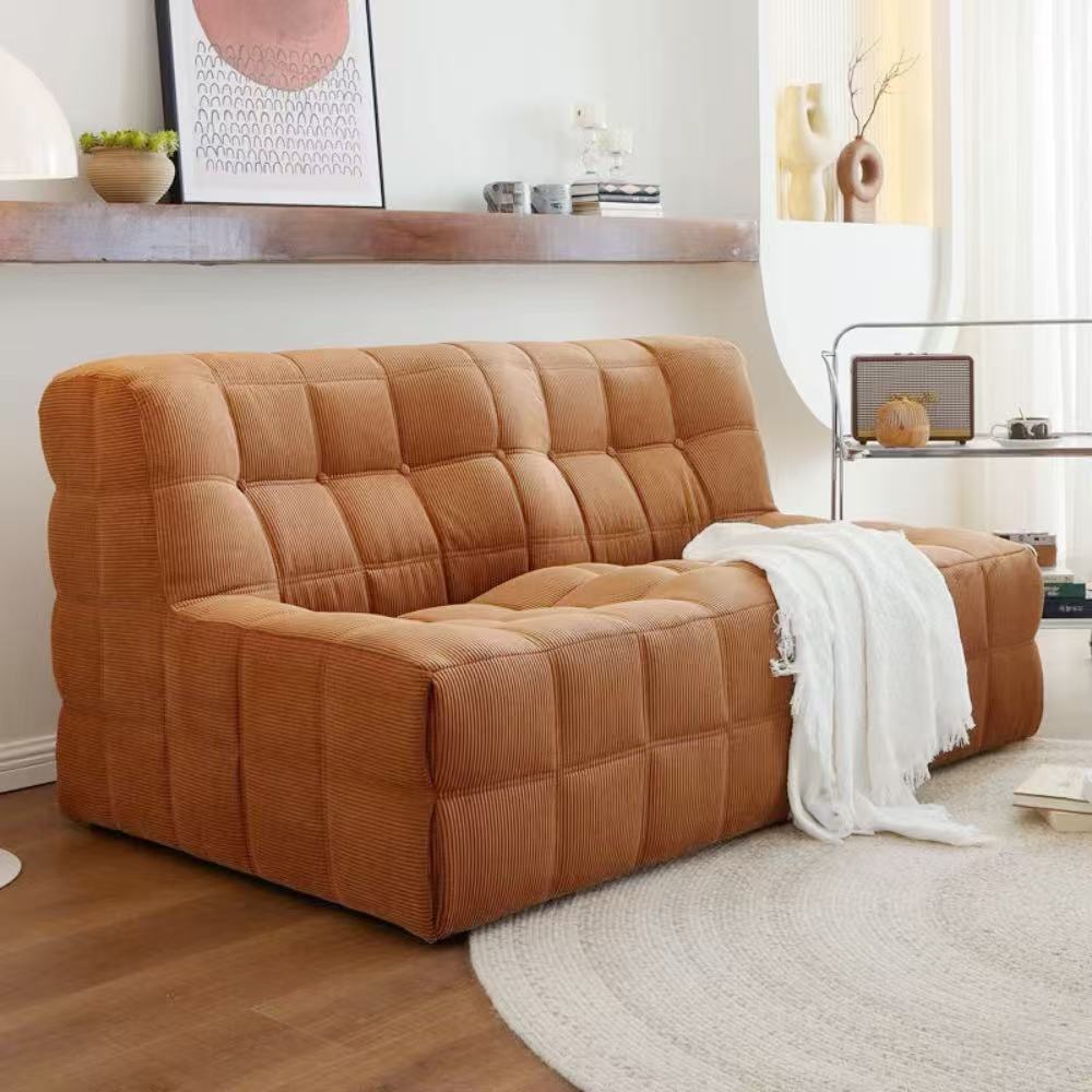 Quilted marshmallow‑style compressed sofa in plush corduroy bouclé—compact cozy seating ideal for small living rooms and guest areas.