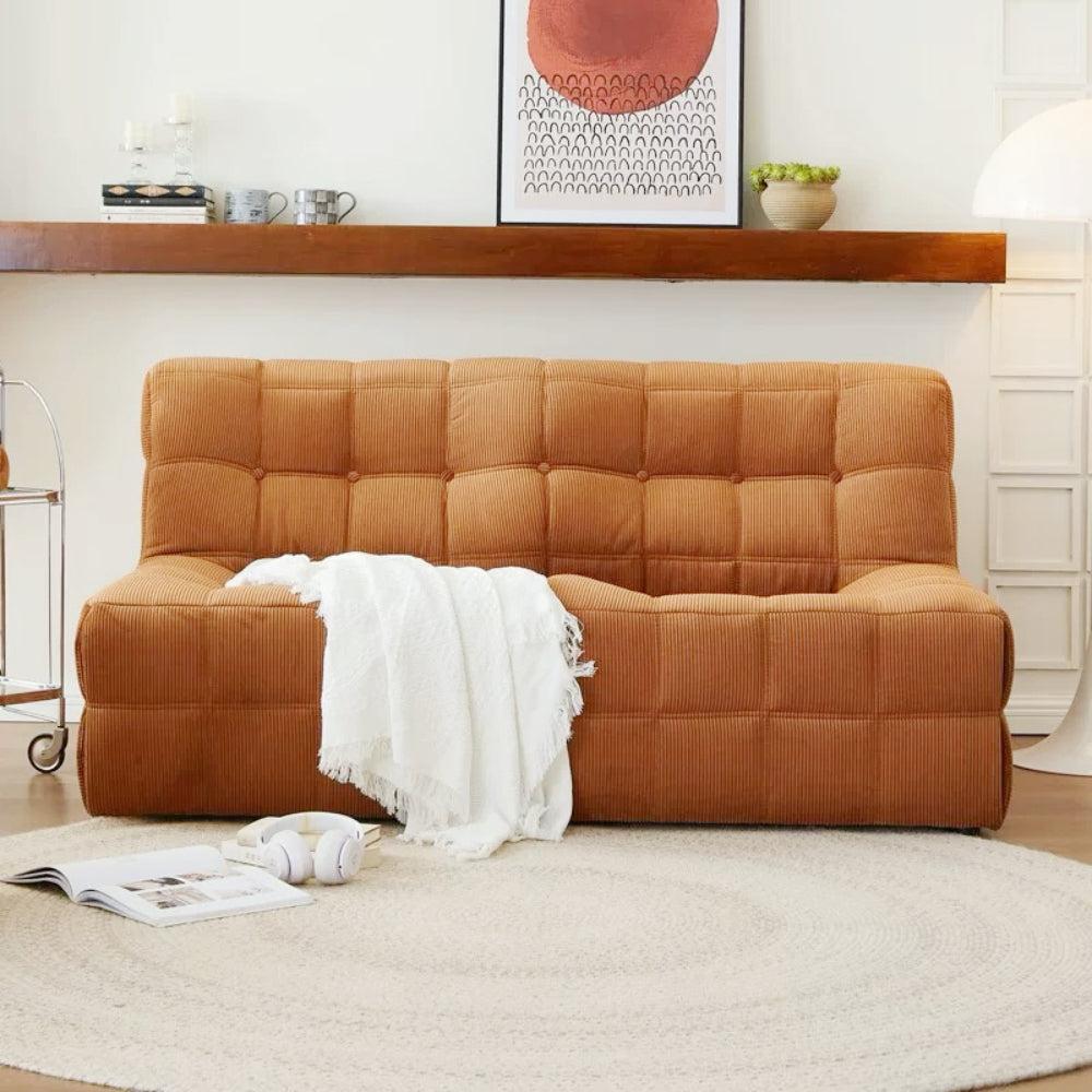 Quilted marshmallow‑style compressed sofa in plush corduroy bouclé—compact cozy seating ideal for small living rooms and guest areas.