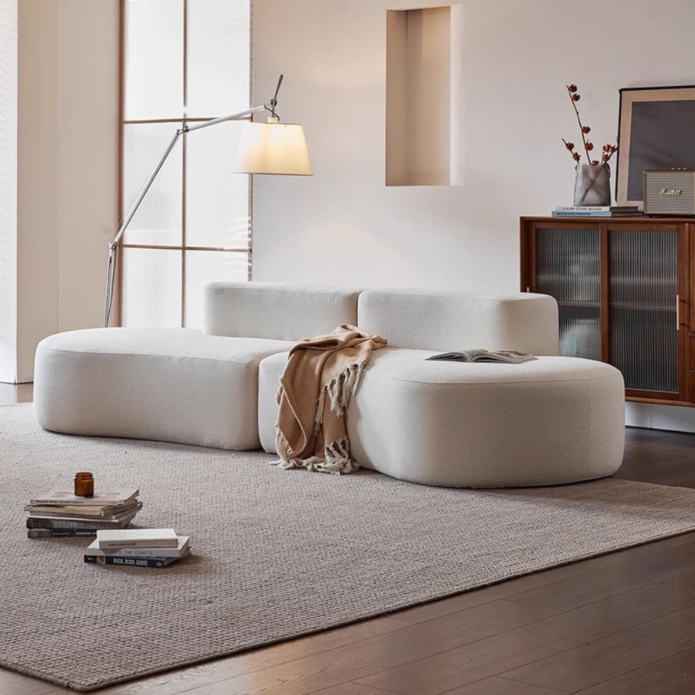 Wave-shaped teddy velvet sofa in white/brown/green—plush curvy design, vacuum-packed single or multi-seat options, ideal for living rooms, studios and guest areas.