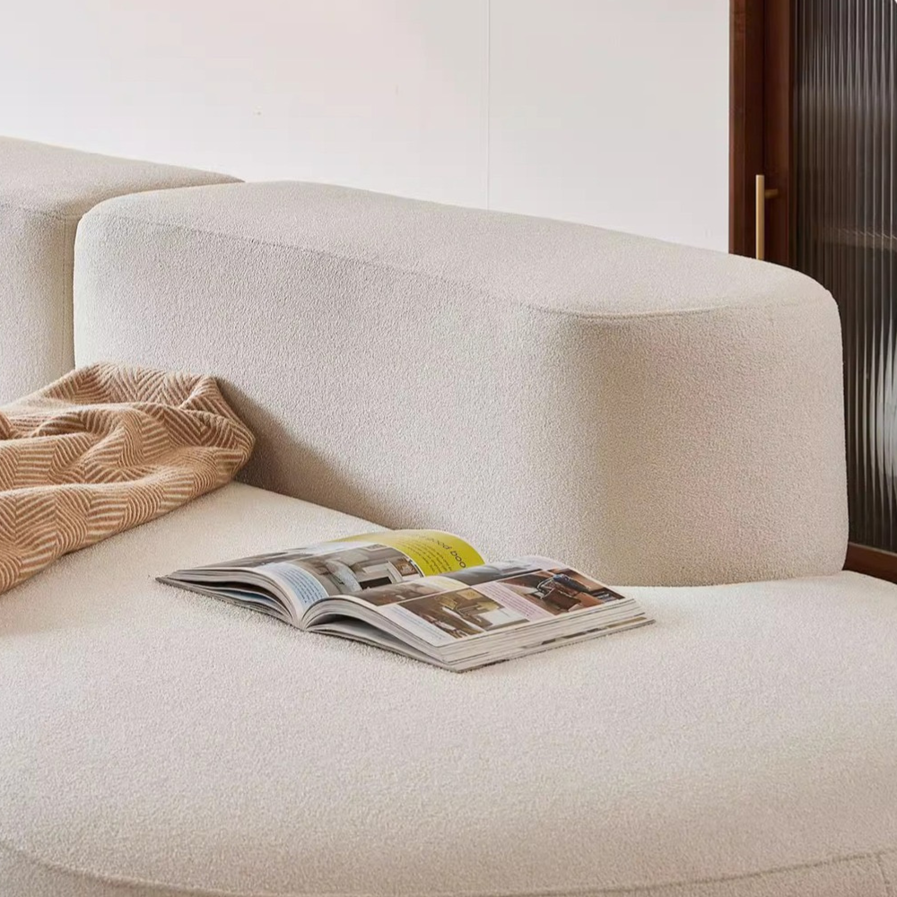 Wave-shaped teddy velvet sofa in white/brown/green—plush curvy design, vacuum-packed single or multi-seat options, ideal for living rooms, studios and guest areas.