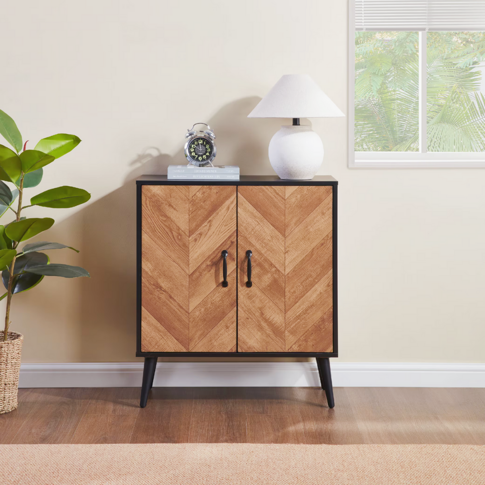 Modern black and wood herringbone storage cabinet with double doors for entryway or kitchen organization.