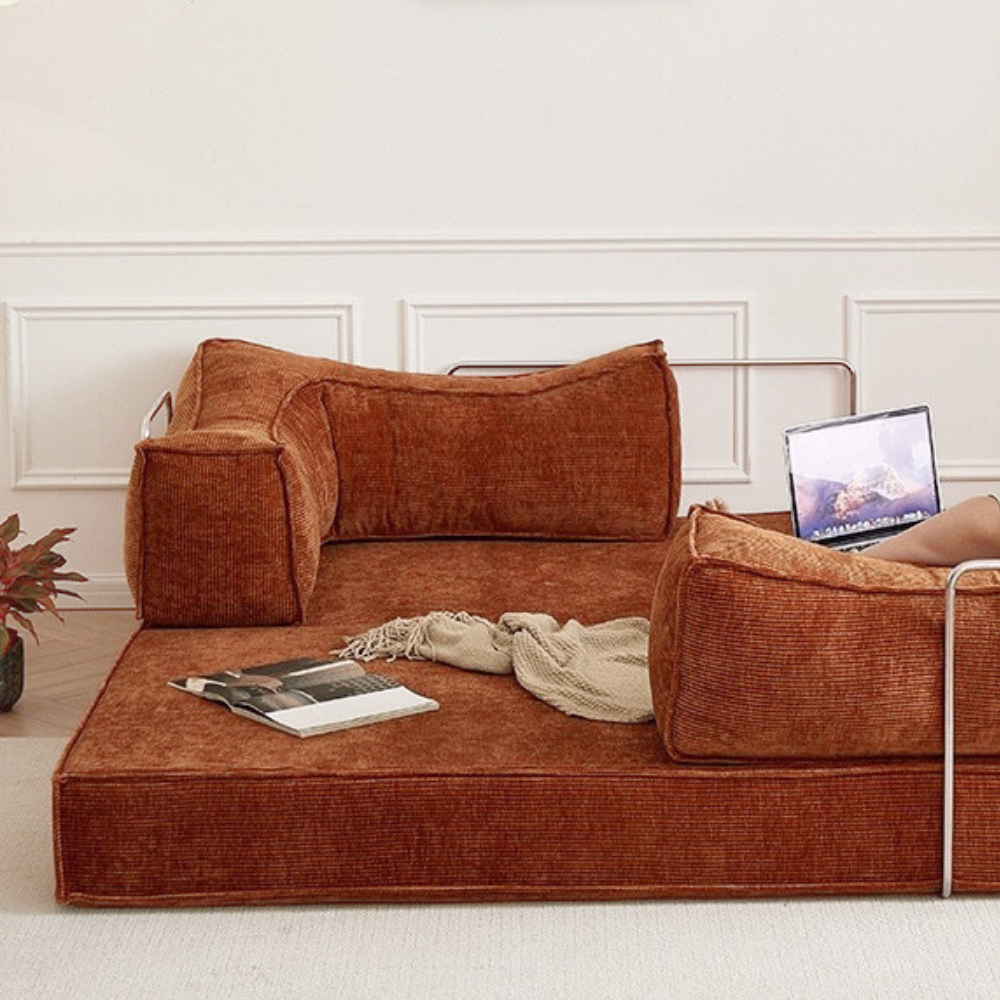 Compressed modular sofa bed in brown corduroy or yellow linen – deep seat, convertible, space-saving, eco-friendly fabric, texture close-up, 2025 trend.