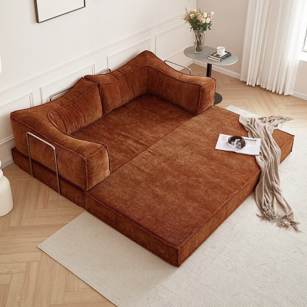 Compressed modular sofa bed in brown corduroy or yellow linen – deep seat, convertible, space-saving, eco-friendly fabric, texture close-up, 2025 trend.