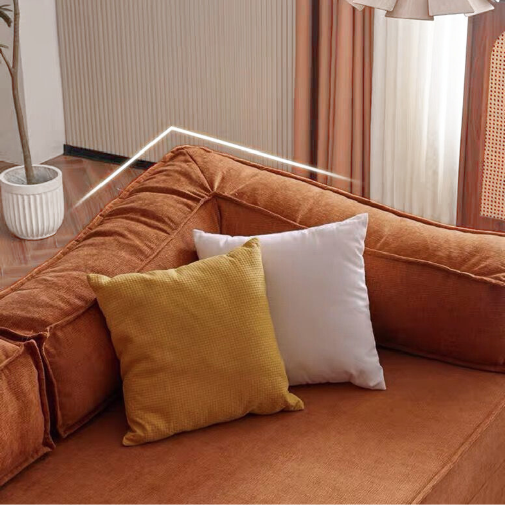 Compressed modular sofa bed in brown corduroy or yellow linen – deep seat, convertible, space-saving, eco-friendly fabric, texture close-up, 2025 trend.