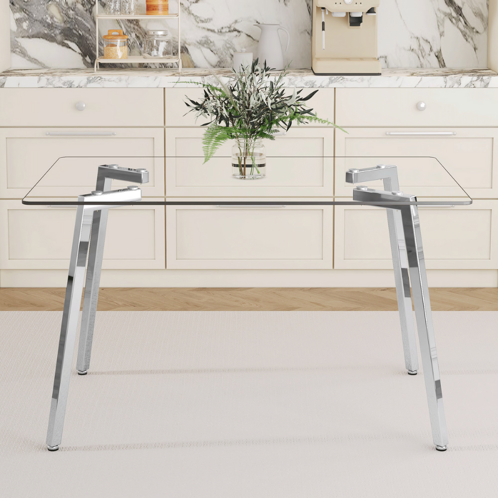 Modern glass dining table with clear tempered top and Z‑shaped metal legs in silver or gold, sleek minimalist design, easy clean, space‑saving.