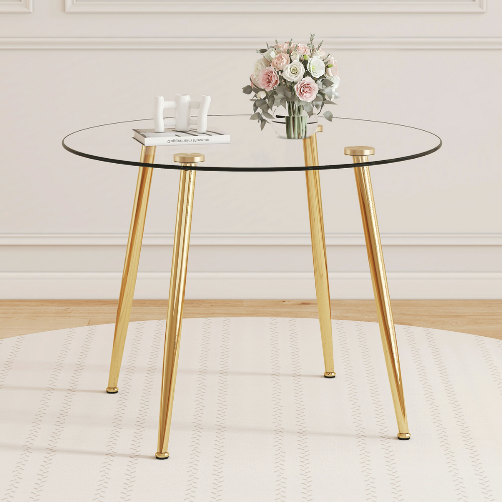 Modern round glass dining table with 39.7″ tempered glass top and slanted metal legs in silver or gold, minimalist space‑saving design, easy to clean.