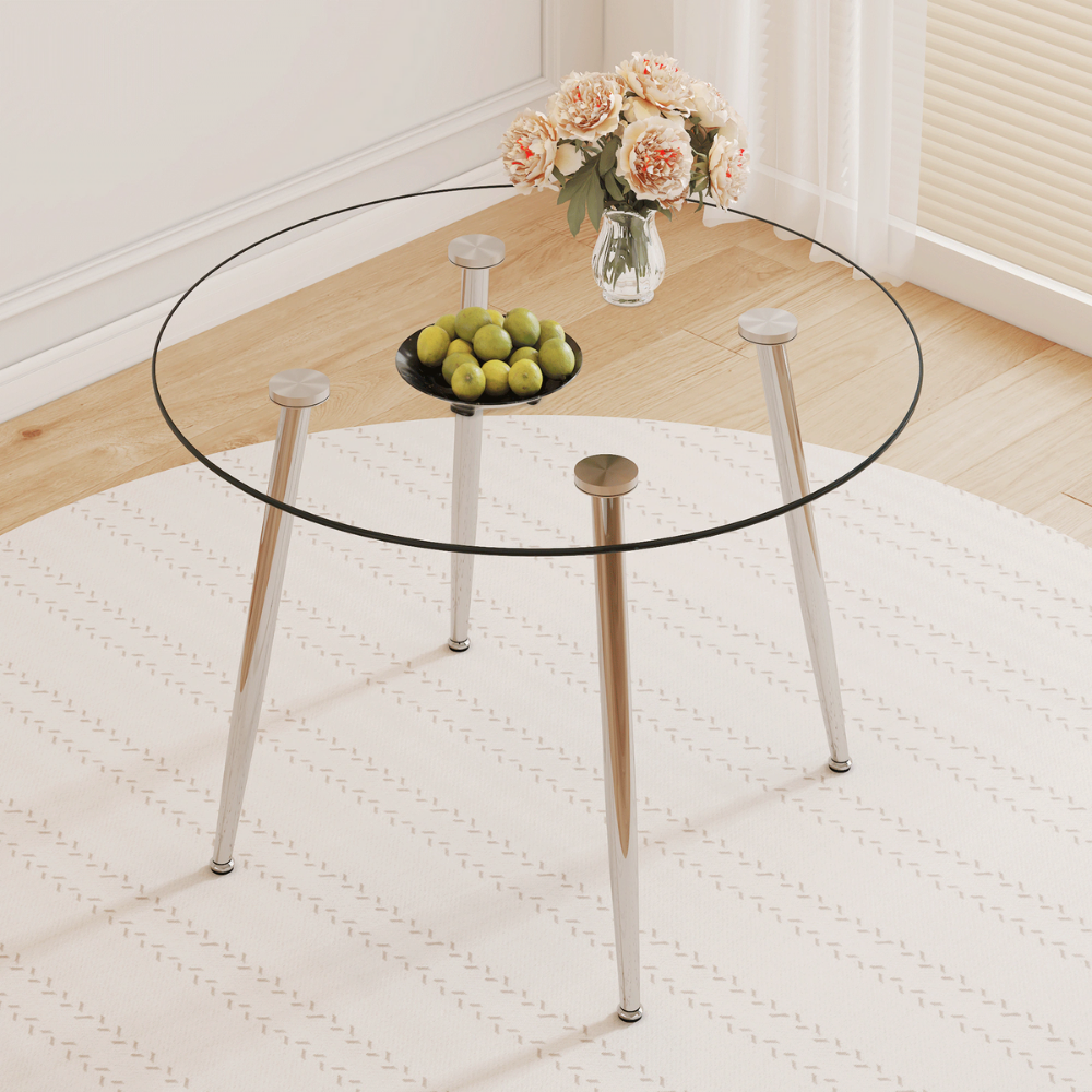 Modern round glass dining table with 39.7″ tempered glass top and slanted metal legs in silver or gold, minimalist space‑saving design, easy to clean.