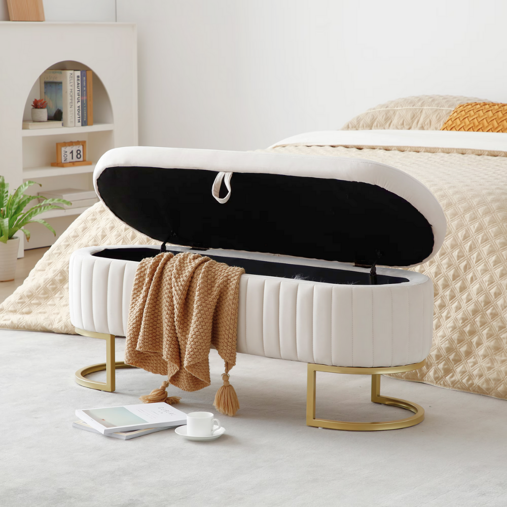 50″ velvet storage bench with oval upholstered seat, gold metal legs, hidden storage under lift‑top, modern end‑of‑bed accent piece.