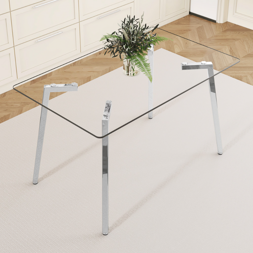 Modern glass dining table with clear tempered top and Z‑shaped metal legs in silver or gold, sleek minimalist design, easy clean, space‑saving.