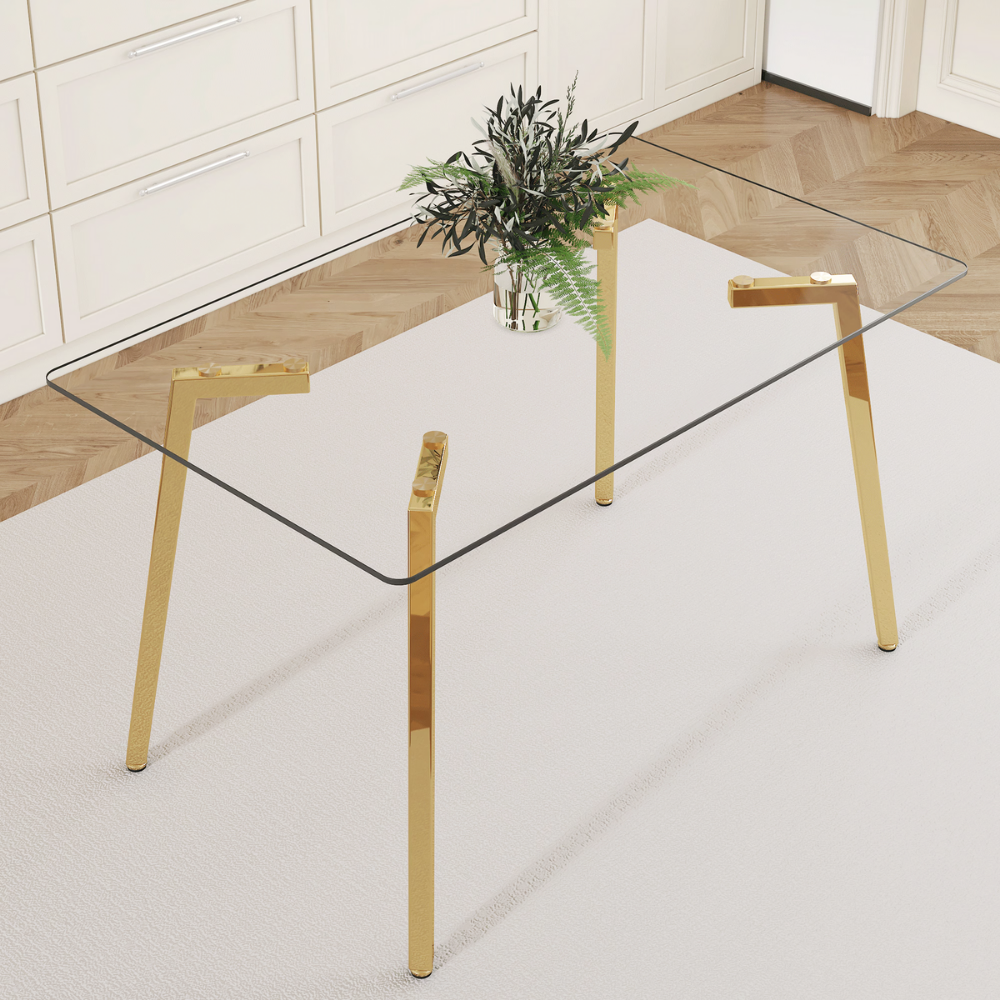 Modern glass dining table with clear tempered top and Z‑shaped metal legs in silver or gold, sleek minimalist design, easy clean, space‑saving.