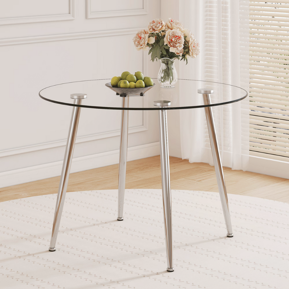 Modern round glass dining table with 39.7″ tempered glass top and slanted metal legs in silver or gold, minimalist space‑saving design, easy to clean.