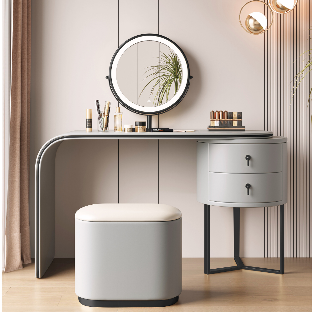 Modular lighted round mirror vanity with glowing LED ring, dual drawers, fabric-lined storage cabinet, and padded stool in elegant tones.