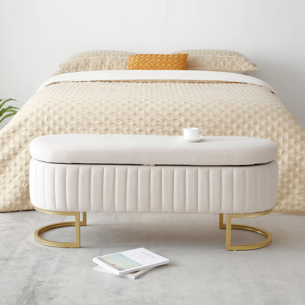 50″ velvet storage bench with oval upholstered seat, gold metal legs, hidden storage under lift‑top, modern end‑of‑bed accent piece.