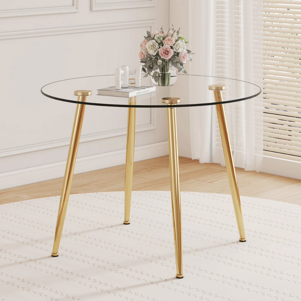 Modern round glass dining table with 39.7″ tempered glass top and slanted metal legs in silver or gold, minimalist space‑saving design, easy to clean.