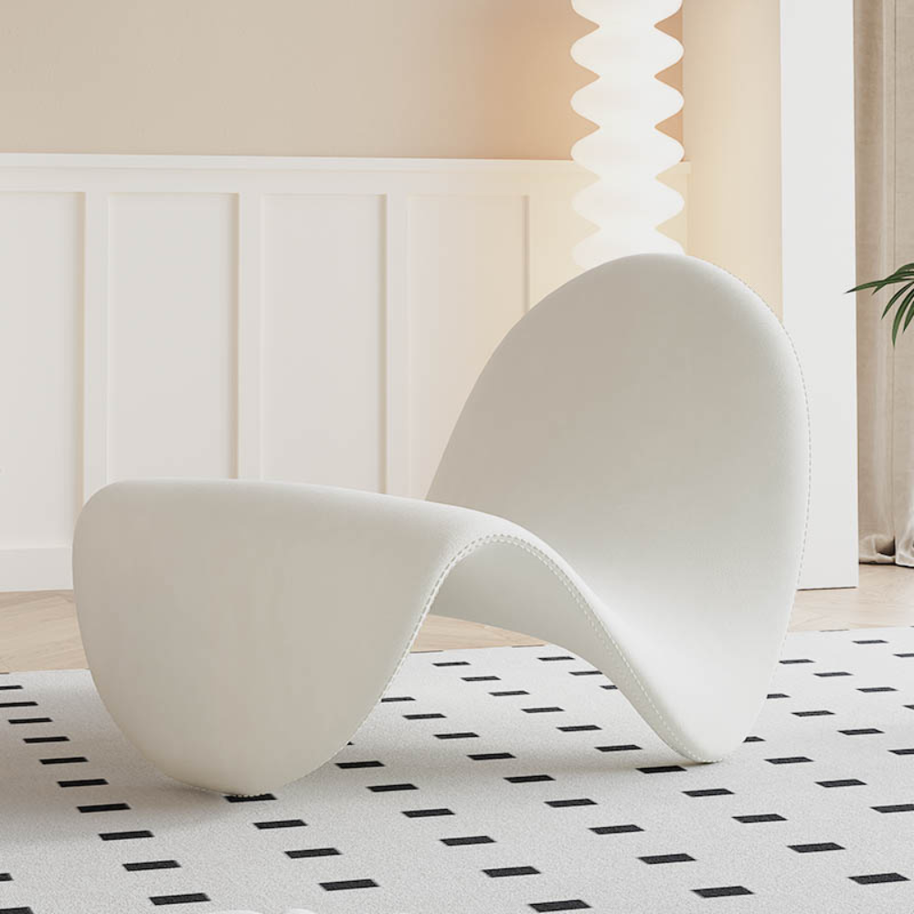 Homiyu sculptural wave lounge chair with soft sherpa or suede upholstery, modern curved silhouette as a statement art piece in living space.