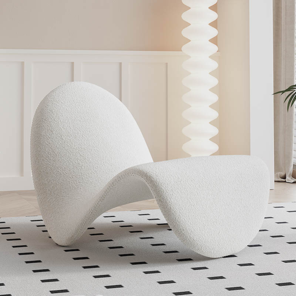 Homiyu sculptural wave lounge chair with soft sherpa or suede upholstery, modern curved silhouette as a statement art piece in living space.