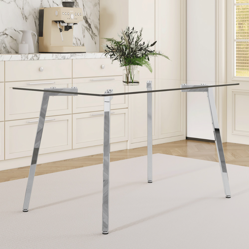 Modern glass dining table with clear tempered top and Z‑shaped metal legs in silver or gold, sleek minimalist design, easy clean, space‑saving.
