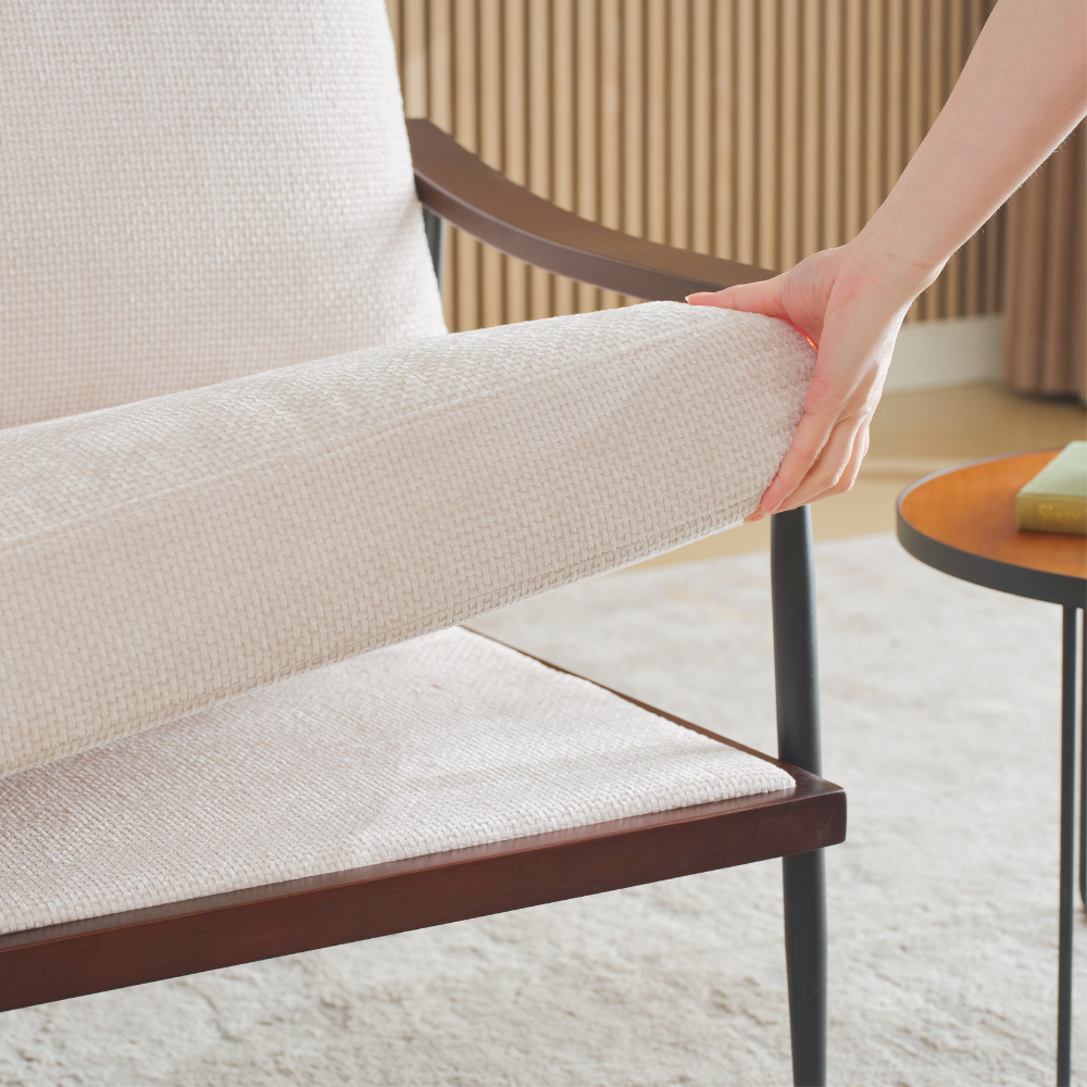 Modern linen fabric arm chair with wooden armrests and metal frame, perfect for living room décor.