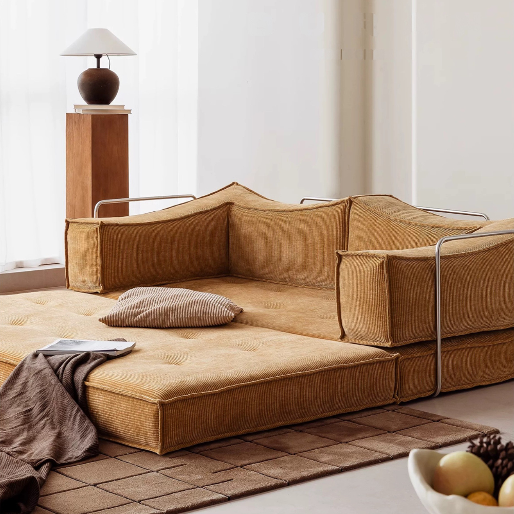 Compressed modular sofa bed in brown corduroy or yellow linen – deep seat, convertible, space-saving, eco-friendly fabric, texture close-up, 2025 trend.